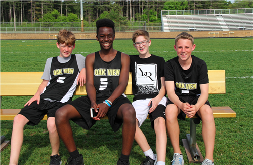 Boys resting at track meet Boys resting at track meet